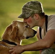 Man kissing his dog